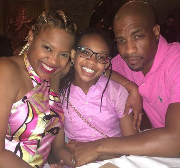 A picture of Masta Ace with his wife and daughter.